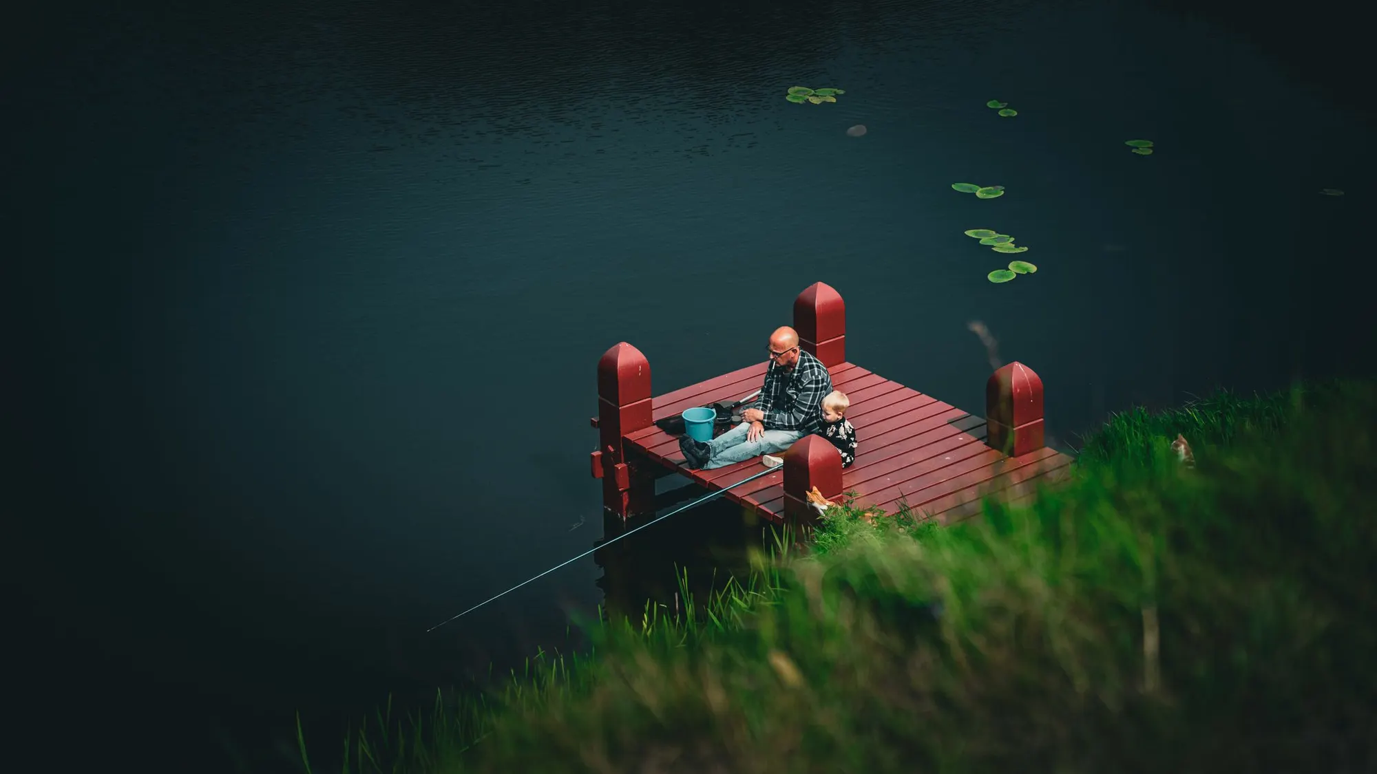 Fishing from the dock with a child